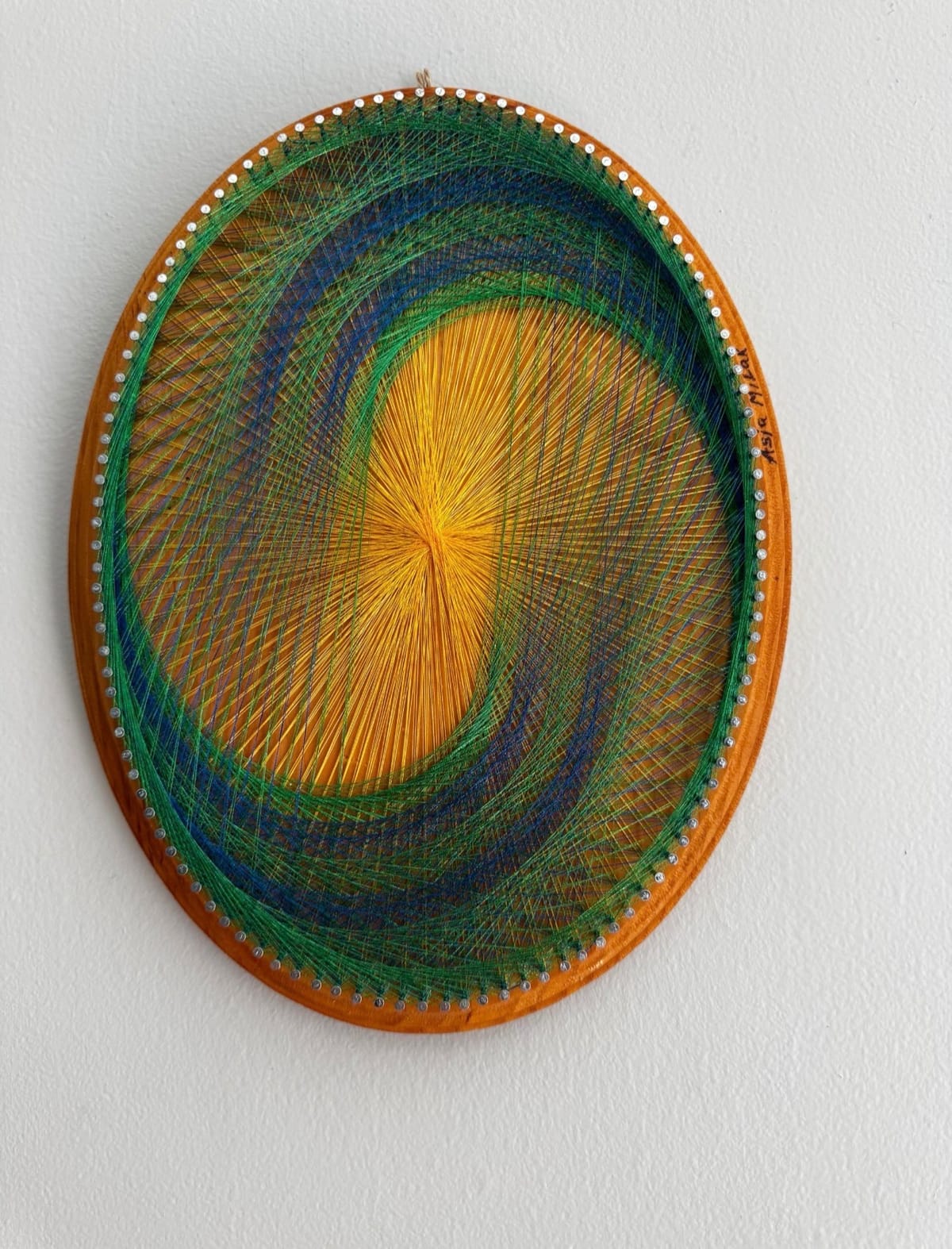 Golden Sunburst Spiral String Art – Blue Green Geometric Wall Art on Natural Wood, detail view 2 — handmade string art by Asja