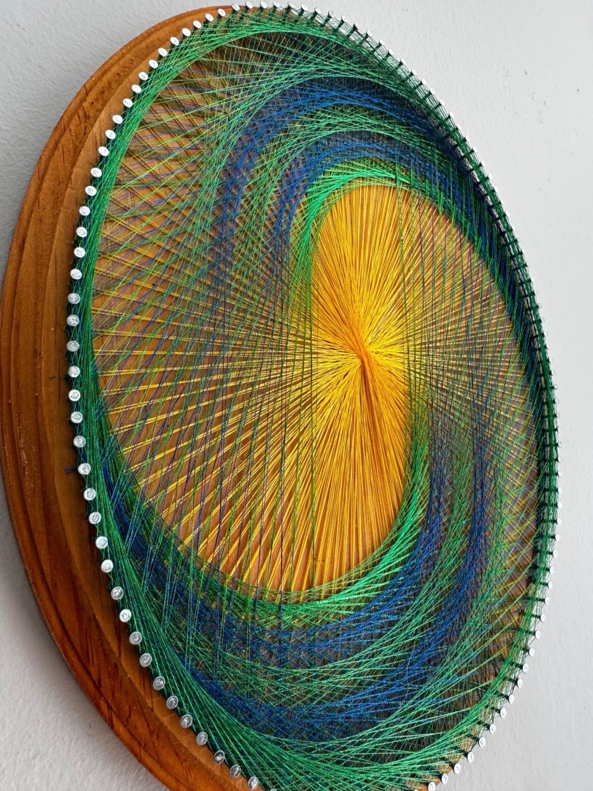 Golden Sunburst Spiral String Art – Blue Green Geometric Wall Art on Natural Wood, detail view 4 — handmade string art by Asja
