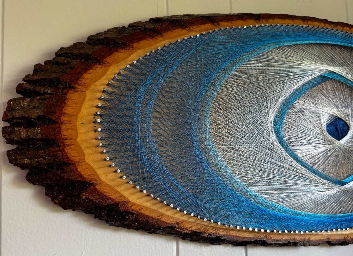 Blue Evil Eye String Art on Wood Slice, detail view 8 — handmade string art by Asja