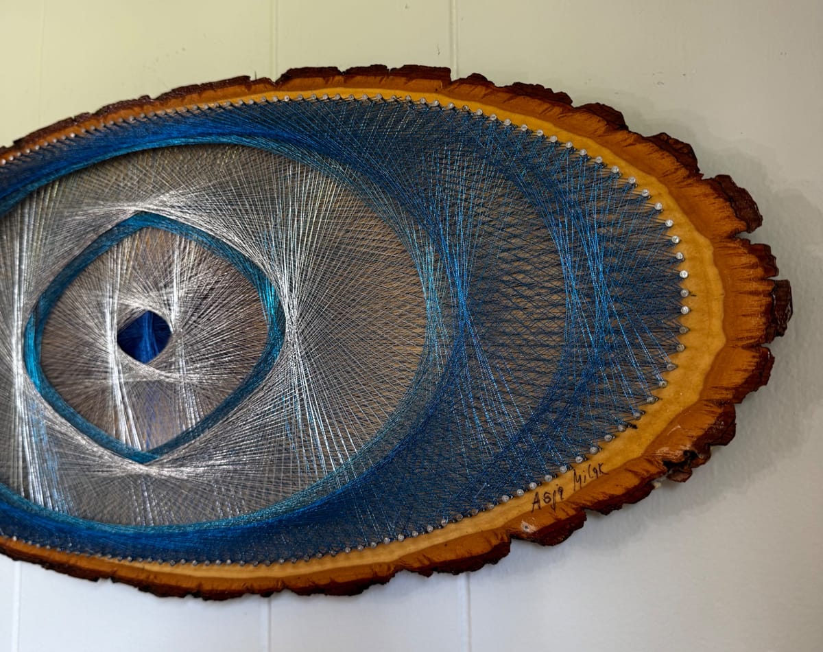 Blue Evil Eye String Art on Wood Slice, detail view 9 — handmade string art by Asja
