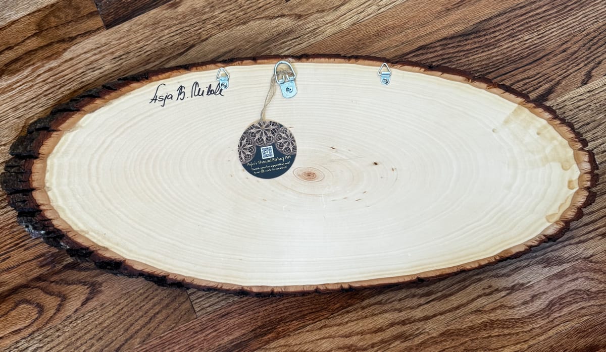 Blue Evil Eye String Art on Wood Slice, detail view 10 — handmade string art by Asja