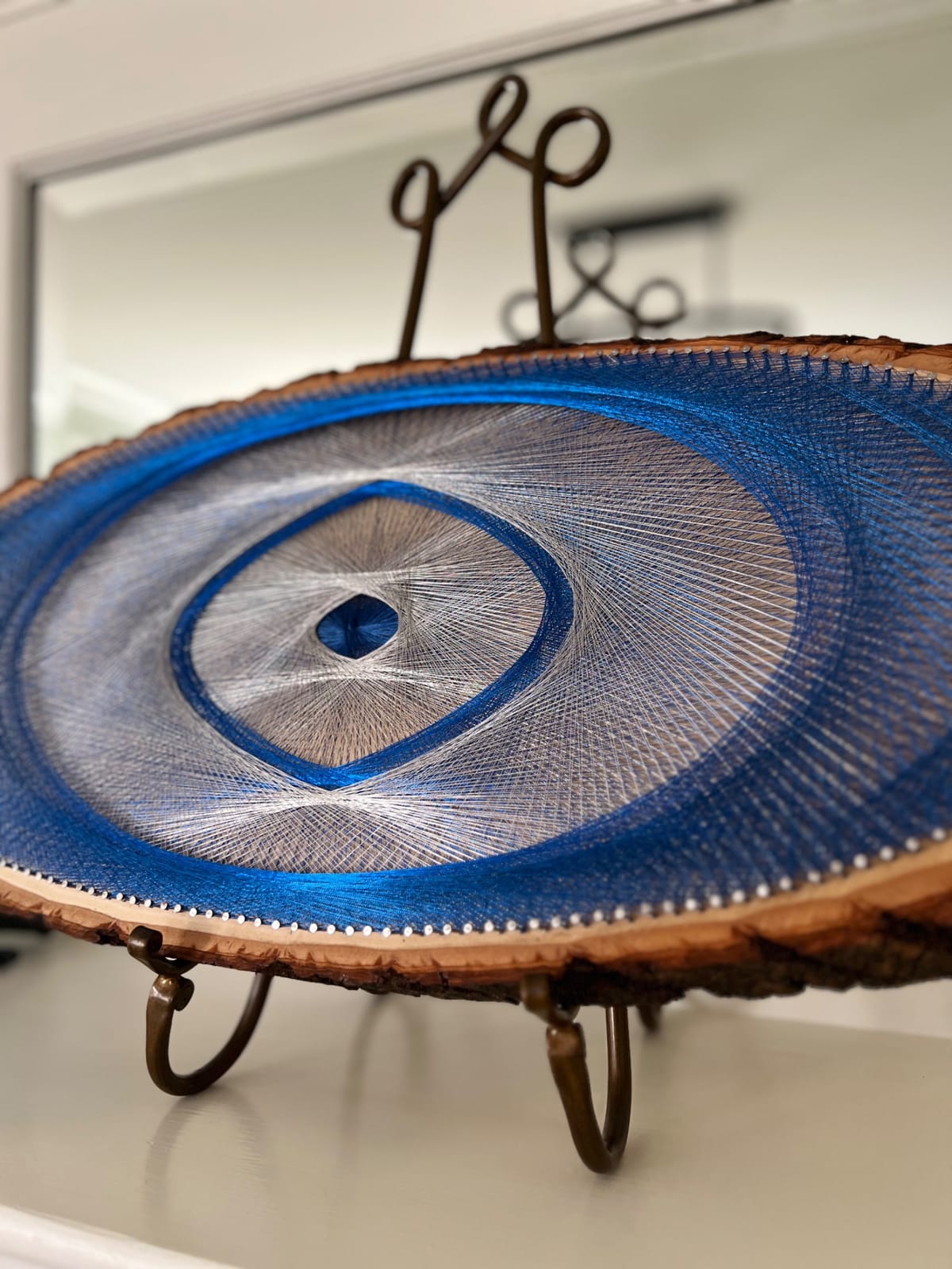 Blue Evil Eye String Art on Wood Slice, detail view 7 — handmade string art by Asja