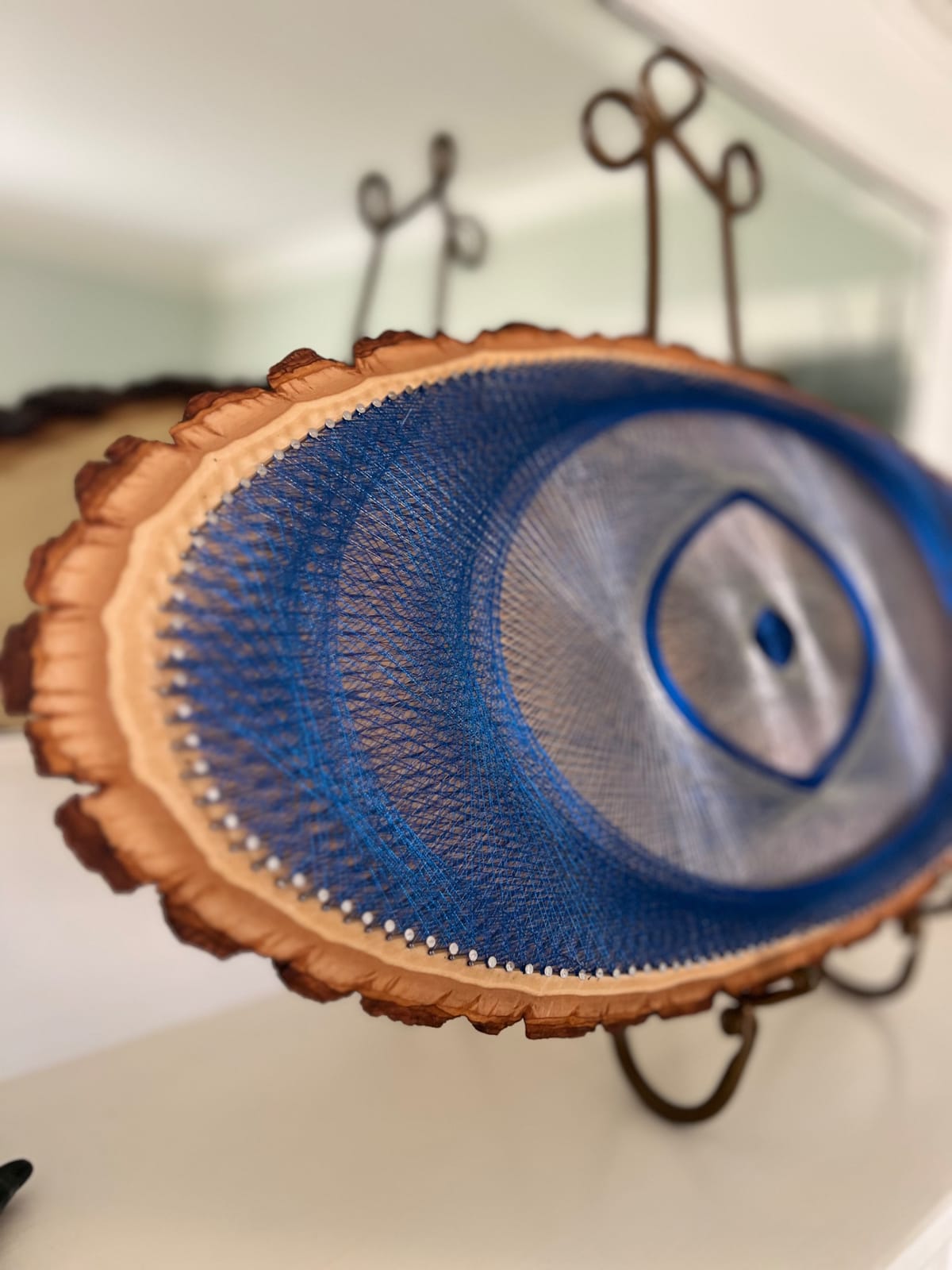 Blue Evil Eye String Art on Wood Slice, detail view 6 — handmade string art by Asja