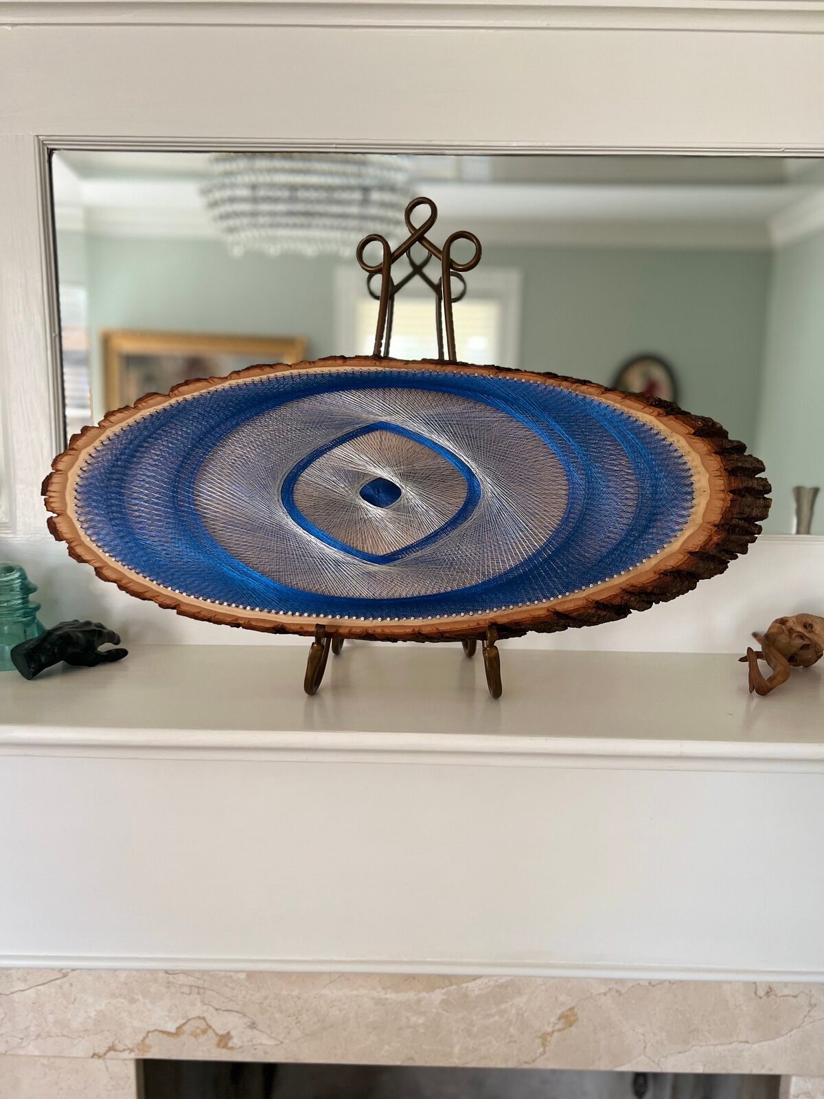 Blue Evil Eye String Art on Wood Slice, detail view 3 — handmade string art by Asja